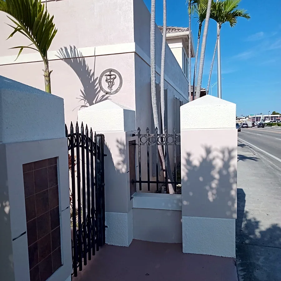 Repainted entrance columns and perimeter wall