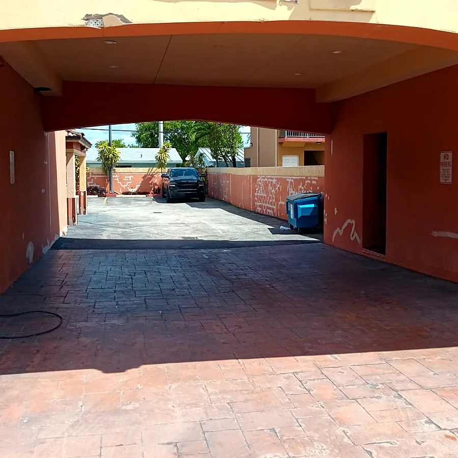 Repainted covered parking entrance in terracotta